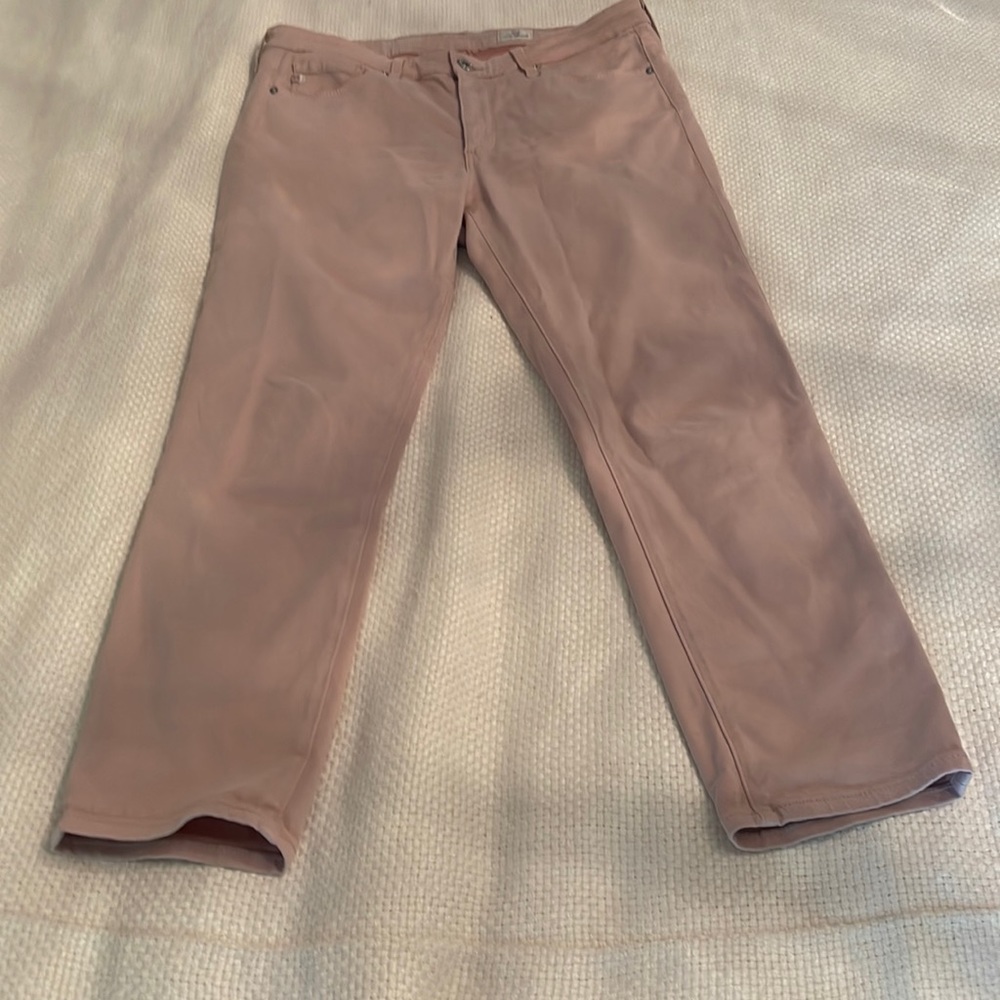 Hey! This is a pair of AG pale pink jeans! Excellent condition!